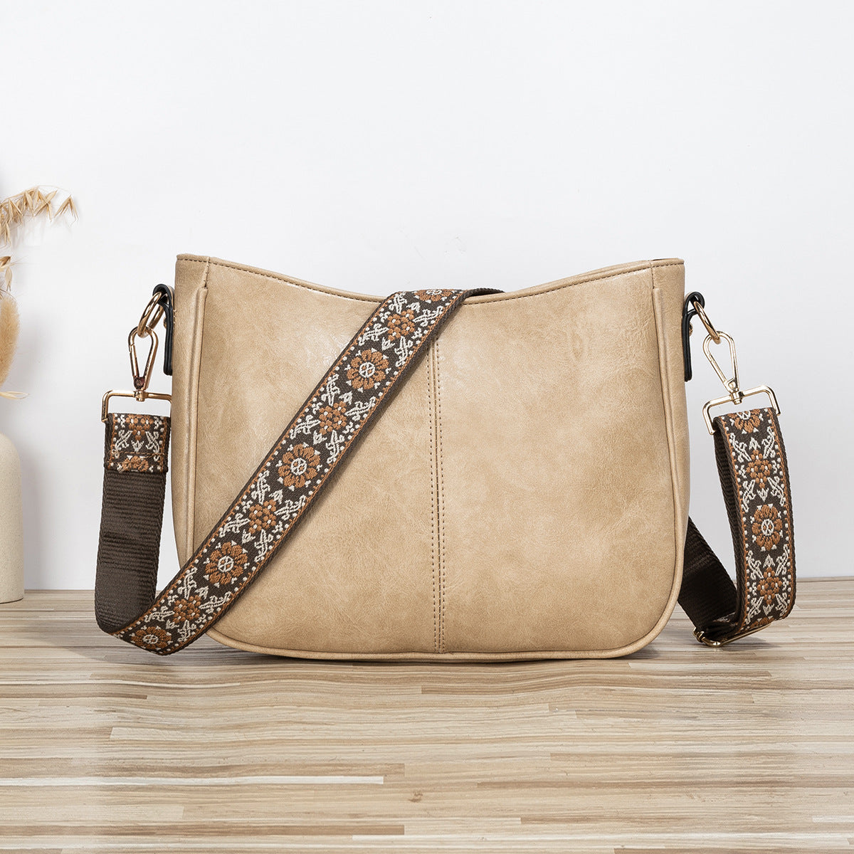 Shoulder bag with patterned strap in khaki