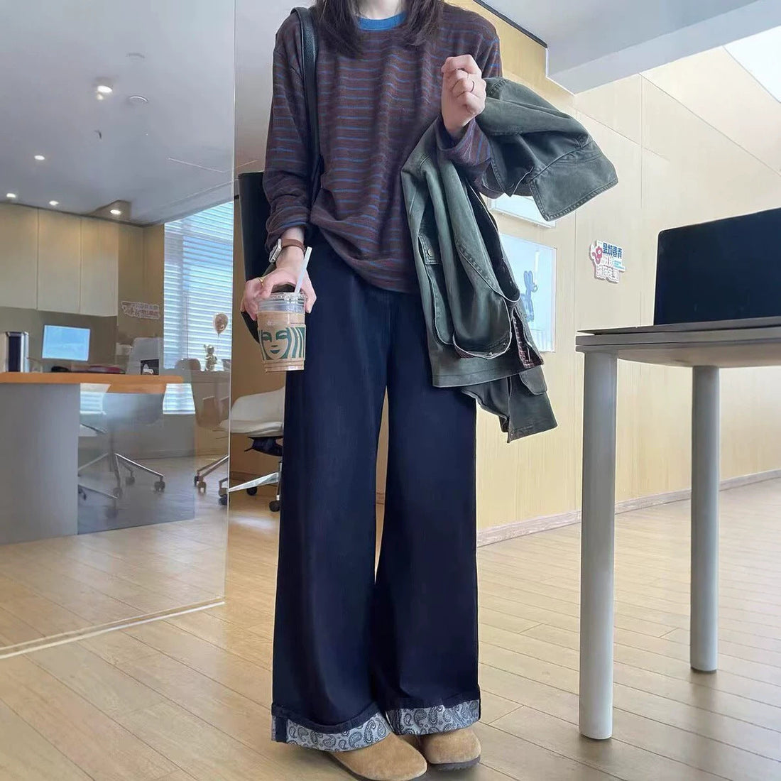Deep blue straight jeans worn with a brown knit