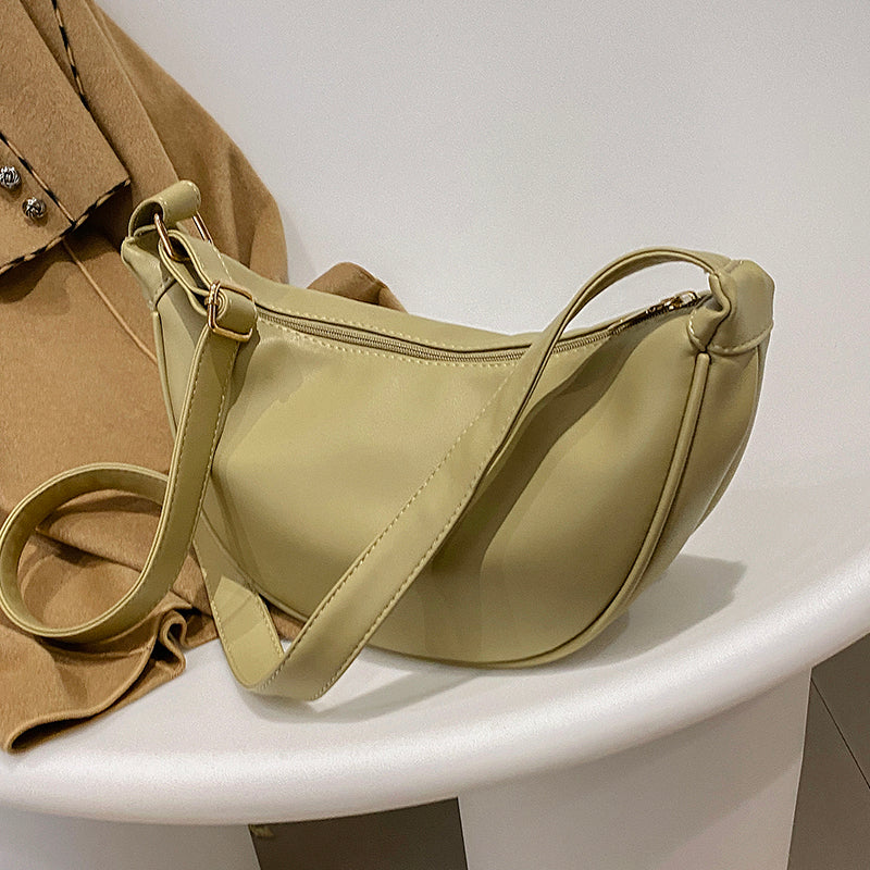 Half-moon crossbody bag in pea green