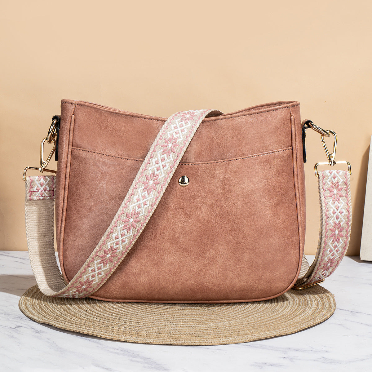 Shoulder bag with patterned strap in pink